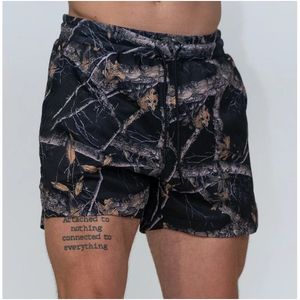 2025กางเกงวิ่งเอวกลางระบายอากาศได้ดีของผู้ชายผ้าแคนวาสกางเกงขาสั้นพิมพ์ลายซับลิเมชันเอวยางยืดดีไซน์สีพื้น - Product Image 4