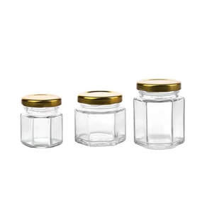 Frasco de vidrio hexagonal de diseñador con tapa Tapa de materiales personalizados de lujo Envase cosmético y tarro de dulces - Product Image 1