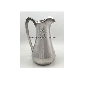 Vintage fancy beverage pitcher with floral etching and a polished finished great for enhancing kitchen <b>table</b> settings - Product Image 1