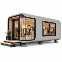 Cabine de luxe Apple de 20 pieds avec structure en acier léger, conception à deux niveaux et aménagement de bureau à rangement flexible pour parcs commerciaux