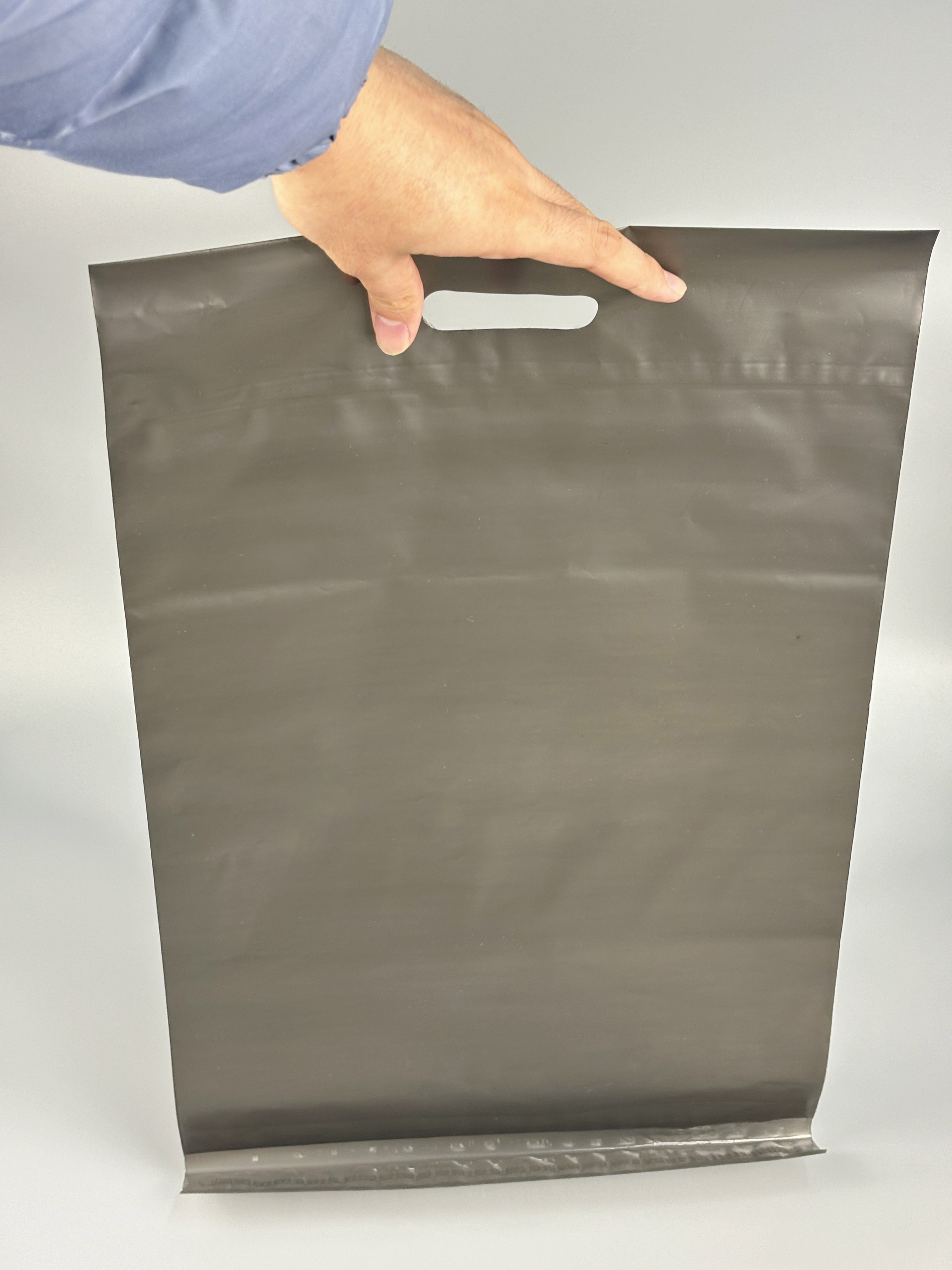 Borsa per la spedizione a mano trasparente nera