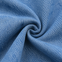 Jean ample taille haute pour femme style Y2K avec détail noué, coupe décontractée, denim délavé clair, écologique et respirant, idéal pour l'été