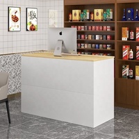 Comptoir de réception compact moderne avec tiroir et façade blanche, poste de travail ouvert pour projets d'aménagement intérieur contemporains