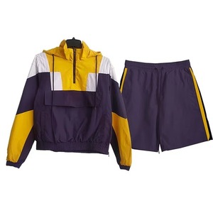 Conjunto de pantalones cortos y chaquetas de nailon de poliéster, traje de jogging para hombre, conjuntos cortos cortavientos de gran tamaño con contraste de Color de retazos para hombre - Product Image 4