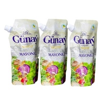 Machine de remplissage et d'emballage pour sachets souples à bec verseur pour vinaigrettes, purées de fruits, avec système de scellage par aspiration