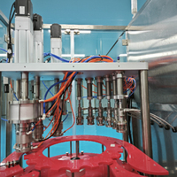 Machine de remplissage et de sertissage automatique pour aérosols en sachet sur valve, peinture en aérosol à base d'eau, remplissage en sachet sur valve