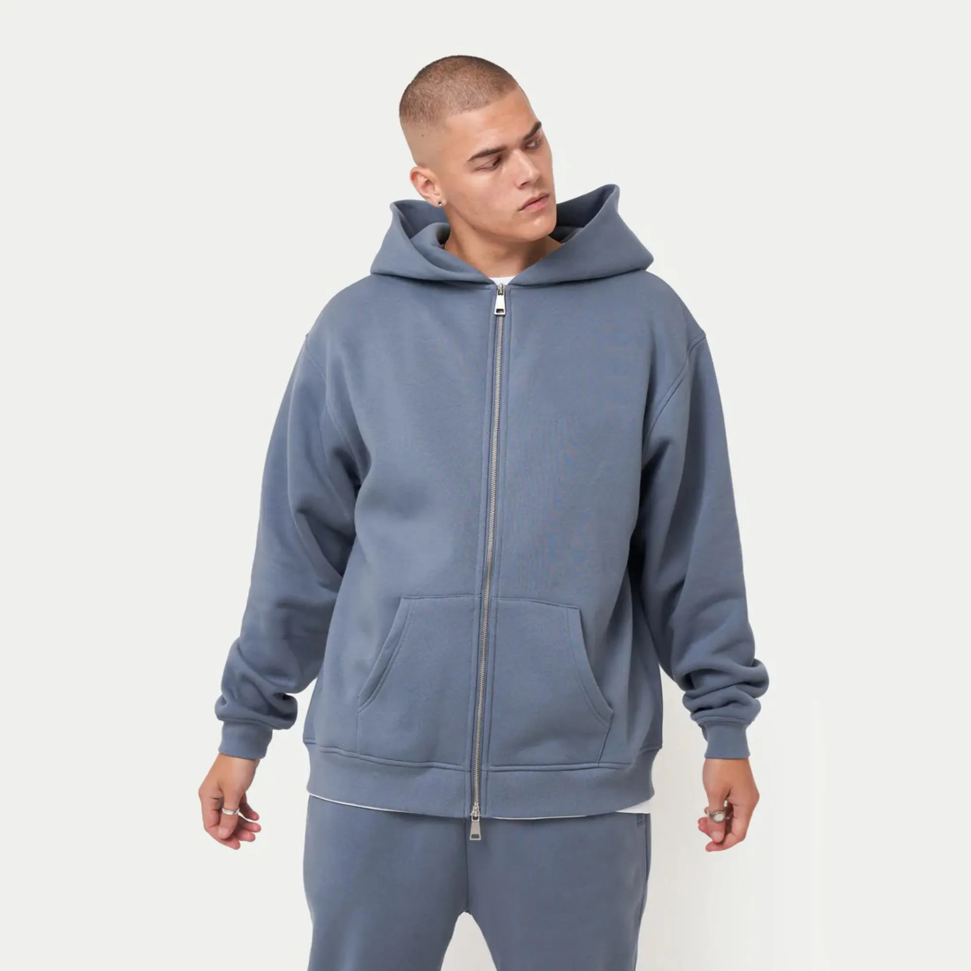 80% Cotton 20% Polyester Dropped shoulders Zip-front style Kangaroo Pockets Ribbed hem and cuffs China Blue Oversized Hoodie