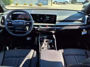 Magnifique BMW X-Line SX Prestige AWD 2024 Marron Foncé d'occasion avec toit ouvrant panoramique, démarrage à distance, sièges en cuir et boîte automatique - Product Image 2