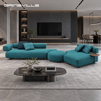 Canapé modulaire design moderne en bleu sarcelle, profil bas, en coton et lin, avec table d'appoint pour villa de luxe