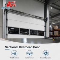 Portes sectionnelles industrielles avec capteurs de détection d'obstacles, activation automatique du recul pour usines et entrepôts.