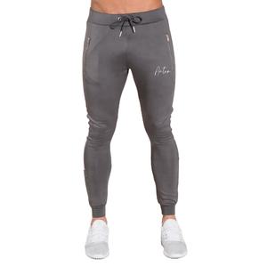 Pantalones de correr ajustados grises para hombre, bolsillos con cremallera, cordón en la cintura, pantalones atléticos, ropa de gimnasio informal, pantalones deportivos cónicos - Product Image 3