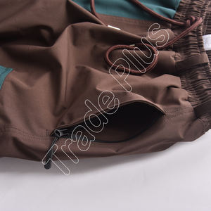 Pantalones de esquí transpirables de fabricante personalizado para hombres y mujeres a prueba de viento estilo holgado pantalones de esquí de nieve ajustados altos para cómodos - Product Image 4