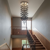 Lampe suspendue LED en acier au design nordique personnalisé, avec pendentif en spirale en pierre de charbon, idéale pour plafonds hauts, villas, hôtels, salons et escaliers