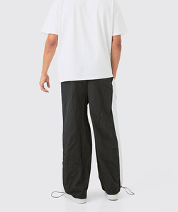 Pantalones Deportivos Holgados de Poliéster Estilo Urbano con Paneles Laterales Estampados, Puños Acanalados Ligeros y Estampado Serigrafiado para Hombre, Precio de Fábrica - Product Image 6