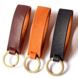 พวงกุญแจหนังสีน้ำตาลพร้อมสัมผัสที่เป็นเอกลักษณ์เหมาะสำหรับการให้เป็นของขวัญแบบมืออาชีพด้วยการนำเสนอระดับพรีเมียมที่ทำด้วยมือ - Product Image 3