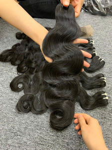 Extensions de cheveux vierges vietnamiens Tissage de cheveux humains bruts du Vietnam Cheveux vierges de qualité 100g ondulés - Product Image 3