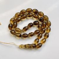 Collier artisanal écoresponsable en ambre de la Baltique avec 33 perles d'ambre vertes et insectes, Tasbih musulman, bijoux Amberstone