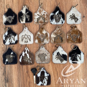 Vente en gros de porte-clés en cuir de vachette, gravure laser, porte-clés unisexe en cuir véritable de luxe, porte-clés d'accessoires - Product Image 1