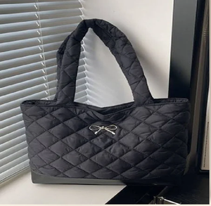 Luxury black croc-effect tote with a bow and <b>heart</b> charm. Glamorous. Available at wholesale prices. - Product Image 1