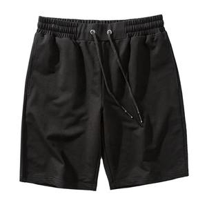 Short de gymnastique à séchage rapide pour hommes Vêtements de sport de course à pied et de basket-ball Logo personnalisé Vente en gros Fermeture à cordon de serrage Teint uni - Product Image 1