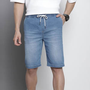 กางเกงยีนส์ขาสั้นผู้ชายสไตล์ลำลองสำหรับวันหยุดสุดสัปดาห์ ลุคสบายๆ สไตล์คนเมือง สีฟ้าอินดิโก้ซีดจาง ดีไซน์คลาสสิก - Product Image 1