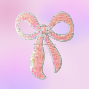 Parche Termoadhesivo Elegante con Lazo Rosa y Lentejuelas para Ropa y Bolsos - Product Image 1