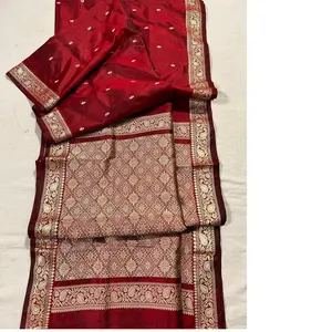 custom made brocade silk fabrics in red color with gold borders ideal for resale by clothing designers and fashion stores