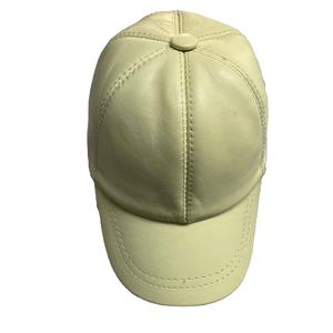 This is a light <b>yellow</b> genuine leather baseball cap with an adjustable strap - Product Image 1