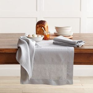 Statement linen table <b>runners</b> with bold embroidery work creating striking dining table impressions luxury homes - Product Image 1