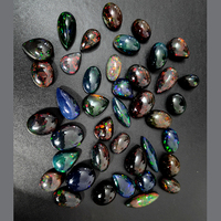 18 Pièces d'Opale Noire Éthiopienne Naturelle avec Effet de Feu, Coupe Ovale 10mm-20mm, Cabochon Poire, 87 Carats, Pierres Précieuses Iroc Sales