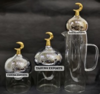 Meilleures ventes 2026 Pot de rangement en verre artisanal attrayant pour la décoration de table du Ramadan Nouveau style avec couvercle en forme de minaret et pichet pour l'Aïd