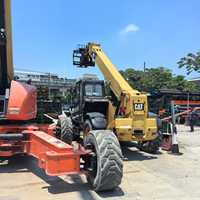 Chariot télescopique Caterpillar TH414 d'occasion, 2 tonnes, haute performance, diesel, tout-terrain, 4x4, avec mât à trois sections, hauteur de levage de 13,7 m