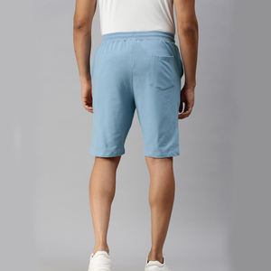 กางเกงขาสั้นผ้าโพลีเอสเตอร์เนื้อนุ่มสำหรับผู้ชายกางเกงขาสั้นสำหรับยิมแห้งเร็วระบายอากาศได้ดีสีฟ้าพื้นสีฟ้า - Product Image 1