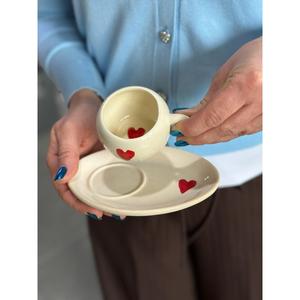 Cuore turco tazza di caffè con piattino