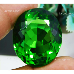 พลอยเพอริดอทสีเขียวธรรมชาติทรงรี น้ำหนัก 155.55 กะรัต คุณภาพระดับ AAA+ ได้รับการรับรอง - Product Image 2