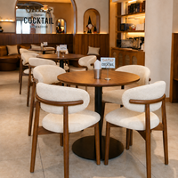 Ensemble de table et chaises de salle à manger en bois massif nordique, avec chaises rembourrées en tissu bouclé moderne de Foshan, pour restaurant