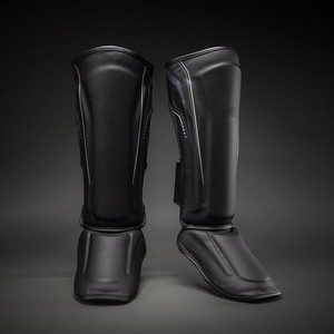 Protège-tibias en cuir noir pour la boxe, le kickboxing et le Muay Thai – Équipement de protection pour l'entraînement - Product Image 4