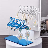 Support à boucles d'oreilles élégant et moderne en acrylique transparent, design étanche, taille personnalisable, pour organiser et présenter les boucles d'oreilles en magasin.