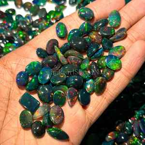 โอปอลเอธิโอเปียสีดำธรรมชาติ รูปไข่เรียบ ขนาด 8x10-10x14 มม. โอปอลไฟแบบหลวม สำหรับทำเครื่องประดับ ราคาโรงงาน - Product Image 1