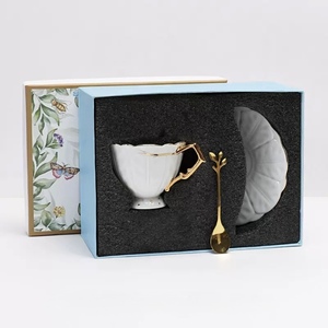 European High Quality Embossed Leaf Pattern Bone <b>China</b> Coffee <b>Cup</b> and Saucer Set featuring gold rim and handle - Product Image 5