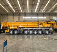 Grue télescopique robuste XCA1000G9-1 de couleur jaune avec moteur, pompe et engrenage, hauteur de levage de 153 m pour les chantiers de construction