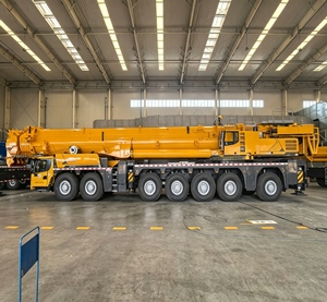Grúa telescópica amarilla XCA1000G9-1 de servicio pesado con motor, bomba y engranajes, altura de elevación de 153 m para patios de construcción - Product Image 1