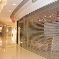 Volets roulants pliables en polycarbonate transparent sur mesure avec rails latéraux en acier inoxydable pour entrepôt et supermarché