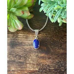 Colgante Religioso Navajo Hecho a Mano con Lapislázuli y Oro Rosa, Engaste de Plata de Ley en Forma de Gota de Agua con Amatista, Joyería Artesanal - Product Image 1