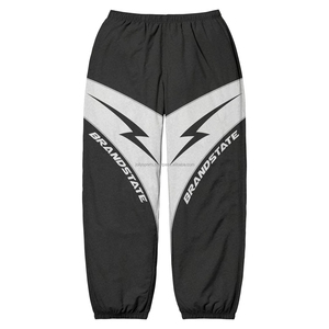 Pantalon de survêtement à boutons personnalisés en gros Pantalon coupe-vent en nylon à rayures pour femmes à vendre Vêtements de ville de haute qualité - Product Image 5