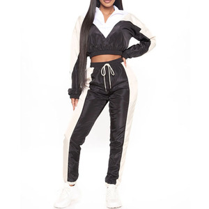 Ensemble de survêtement coupe-vent unisexe personnalisé à blocs de couleur, 2 pièces, avec pantalon de jogging court à taille élastique et manteau à capuche grande taille à séchage rapide pour le printemps - Product Image 1
