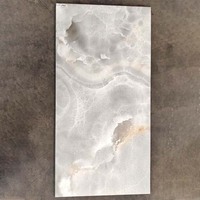 Carreau de sol en porcelaine émaillée polie de 600x1200mm Carreaux de sol en dalle émaillée aspect marbre avec traitement de surface brillant