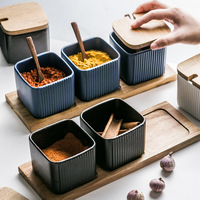 Ensemble de bocaux à épices en céramique blanche de style nordique minimaliste avec couvercles en bambou pour la cuisine