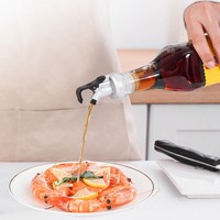 Bouteille d'huile anti-fuite avec bec verseur et bouchon à ouverture et fermeture automatiques