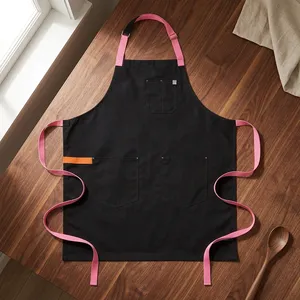Tablier de cuisine robuste réutilisable en toile noire avec bretelles roses, plusieurs poches, pour la cuisine et l'usage quotidien, style simple, tissu tissé - Product Image 1